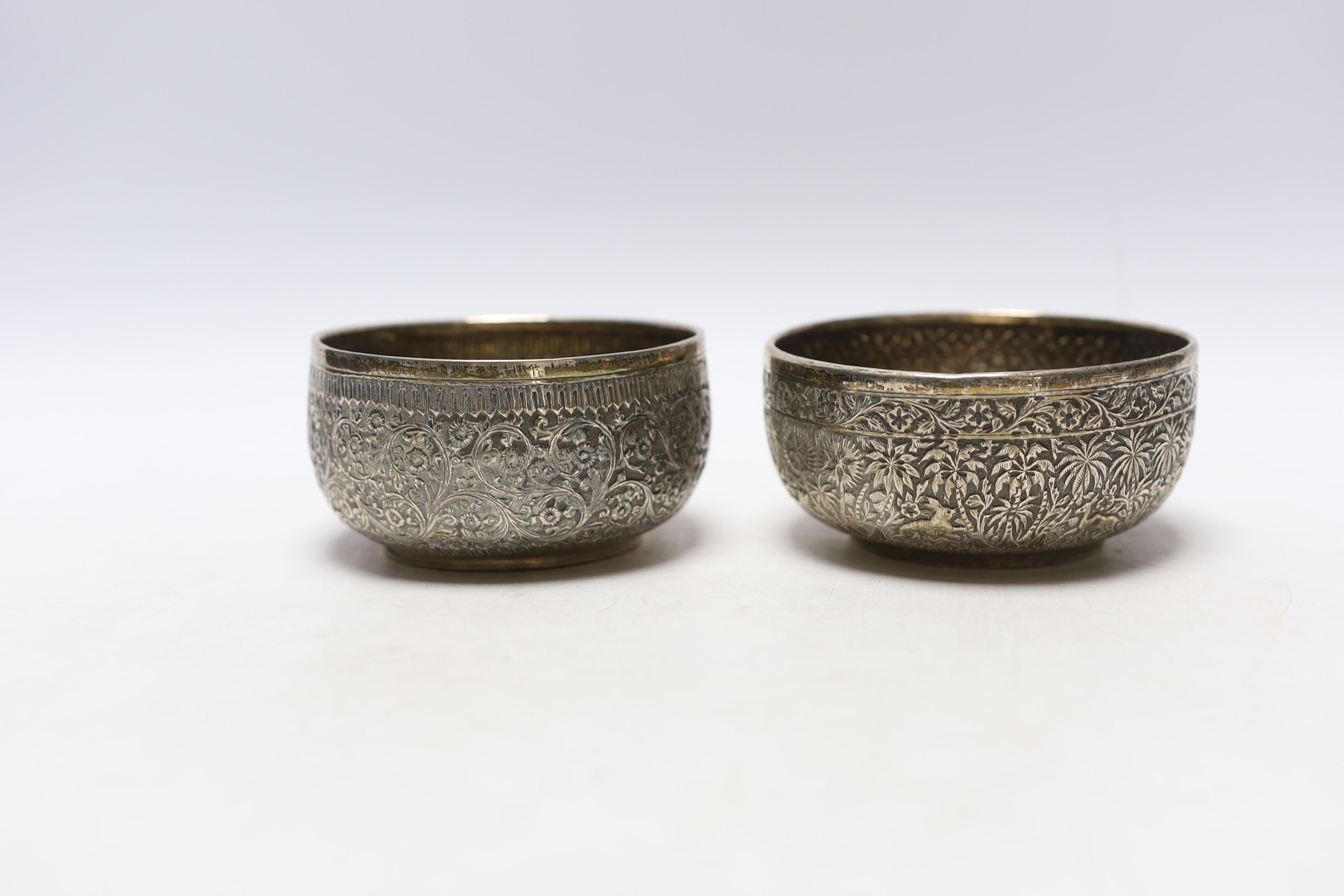 A pair of Indian embossed white metal finger bowls, 10cm, 7.5oz.